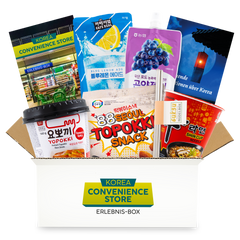 Geöffnete Korea Convenience Store Erlebnis-Box mit Yopokki, Shin Cup, Ade-Drinks und Topokki-Snack